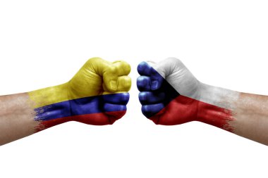 Two hands punch to each others on white background. Country flags painted fists, conflict crisis concept between colombia and czechia