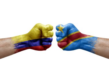 Two hands punch to each others on white background. Country flags painted fists, conflict crisis concept between colombia and dr congo