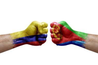 Two hands punch to each others on white background. Country flags painted fists, conflict crisis concept between colombia and eritrea