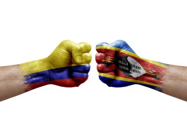 Two hands punch to each others on white background. Country flags painted fists, conflict crisis concept between colombia and eswatini
