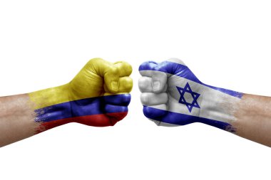 Two hands punch to each others on white background. Country flags painted fists, conflict crisis concept between colombia and israel