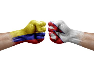 Two hands punch to each others on white background. Country flags painted fists, conflict crisis concept between colombia and nepal
