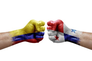 Two hands punch to each others on white background. Country flags painted fists, conflict crisis concept between colombia and panama