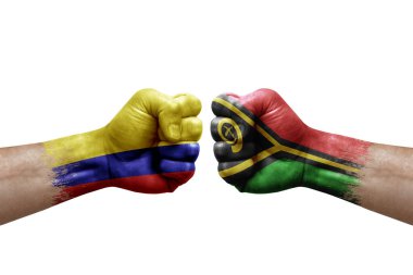 Two hands punch to each others on white background. Country flags painted fists, conflict crisis concept between colombia and vanuatu