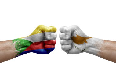 Two hands punch to each others on white background. Country flags painted fists, conflict crisis concept between comoros and cyprus