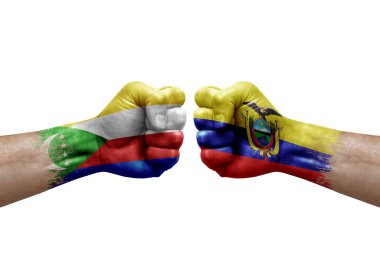 Two hands punch to each others on white background. Country flags painted fists, conflict crisis concept between comoros and ecuador