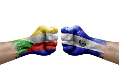 Two hands punch to each others on white background. Country flags painted fists, conflict crisis concept between comoros and el salvador