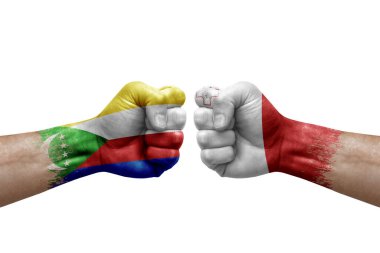 Two hands punch to each others on white background. Country flags painted fists, conflict crisis concept between comoros and malta