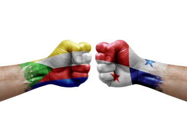 Two hands punch to each others on white background. Country flags painted fists, conflict crisis concept between comoros and panama