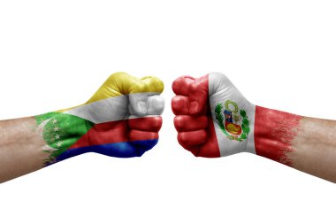 Two hands punch to each others on white background. Country flags painted fists, conflict crisis concept between comoros and peru