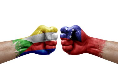 Two hands punch to each others on white background. Country flags painted fists, conflict crisis concept between comoros and samoa