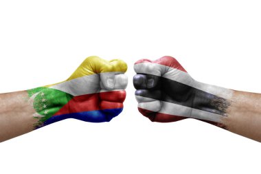 Two hands punch to each others on white background. Country flags painted fists, conflict crisis concept between comoros and thailand