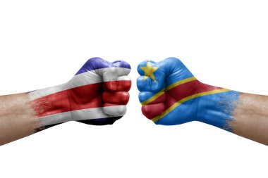 Two hands punch to each others on white background. Country flags painted fists, conflict crisis concept between costa rica and dr congo