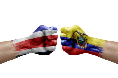 Two hands punch to each others on white background. Country flags painted fists, conflict crisis concept between costa rica and ecuador
