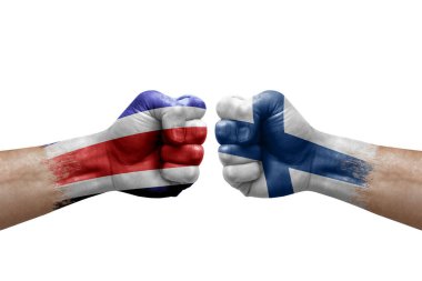 Two hands punch to each others on white background. Country flags painted fists, conflict crisis concept between costa rica and finland