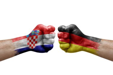 Two hands punch to each others on white background. Country flags painted fists, conflict crisis concept between croatia and germany