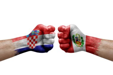 Two hands punch to each others on white background. Country flags painted fists, conflict crisis concept between croatia and peru
