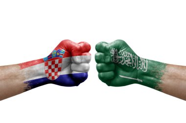 Two hands punch to each others on white background. Country flags painted fists, conflict crisis concept between croatia and saudi arabia