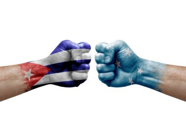 Two hands punch to each others on white background. Country flags painted fists, conflict crisis concept between cuba and micronesia