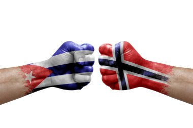 Two hands punch to each others on white background. Country flags painted fists, conflict crisis concept between cuba and norway