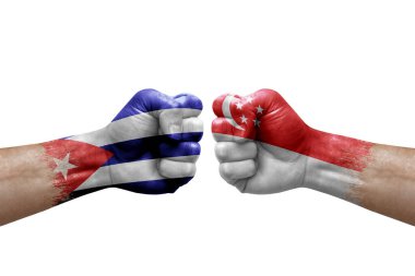 Two hands punch to each others on white background. Country flags painted fists, conflict crisis concept between cuba and singapore