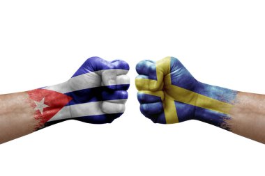 Two hands punch to each others on white background. Country flags painted fists, conflict crisis concept between cuba and sweden