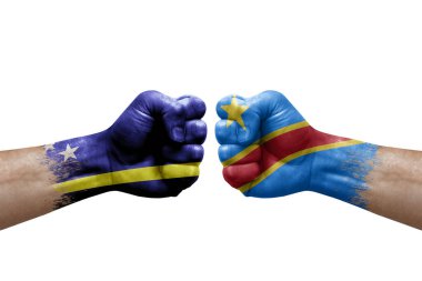 Two hands punch to each others on white background. Country flags painted fists, conflict crisis concept between curacao and dr congo