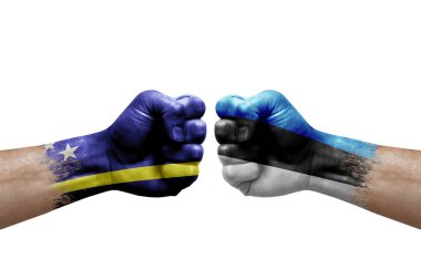 Two hands punch to each others on white background. Country flags painted fists, conflict crisis concept between curacao and estonia