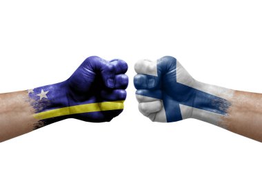 Two hands punch to each others on white background. Country flags painted fists, conflict crisis concept between curacao and finland