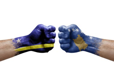 Two hands punch to each others on white background. Country flags painted fists, conflict crisis concept between curacao and kosovo
