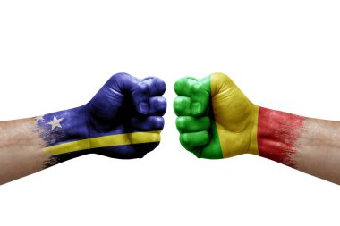 Two hands punch to each others on white background. Country flags painted fists, conflict crisis concept between curacao and mali