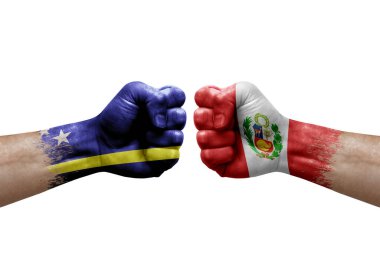 Two hands punch to each others on white background. Country flags painted fists, conflict crisis concept between curacao and peru