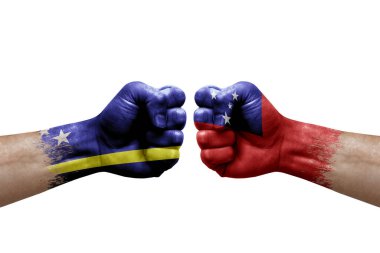 Two hands punch to each others on white background. Country flags painted fists, conflict crisis concept between curacao and samoa