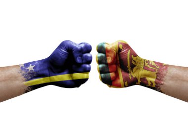 Two hands punch to each others on white background. Country flags painted fists, conflict crisis concept between curacao and sri lanka