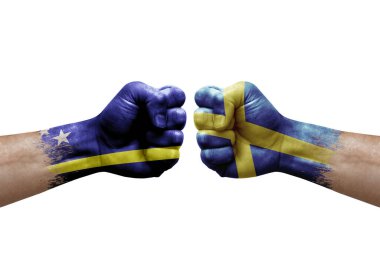 Two hands punch to each others on white background. Country flags painted fists, conflict crisis concept between curacao and sweden