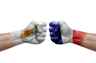 Two hands punch to each others on white background. Country flags painted fists, conflict crisis concept between cyprus and france