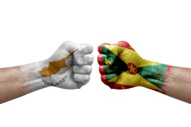 Two hands punch to each others on white background. Country flags painted fists, conflict crisis concept between cyprus and grenada