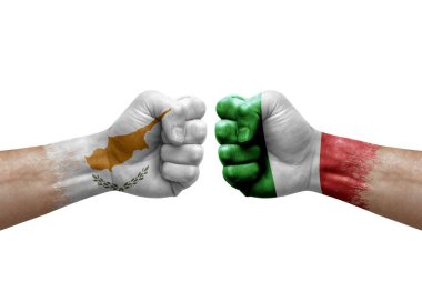 Two hands punch to each others on white background. Country flags painted fists, conflict crisis concept between cyprus and italy
