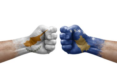 Two hands punch to each others on white background. Country flags painted fists, conflict crisis concept between cyprus and kosovo