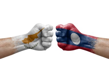 Two hands punch to each others on white background. Country flags painted fists, conflict crisis concept between cyprus and laos