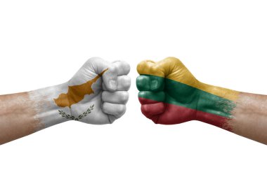 Two hands punch to each others on white background. Country flags painted fists, conflict crisis concept between cyprus and lithuania