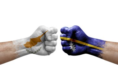 Two hands punch to each others on white background. Country flags painted fists, conflict crisis concept between cyprus and nauru