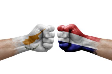 Two hands punch to each others on white background. Country flags painted fists, conflict crisis concept between cyprus and netherlands