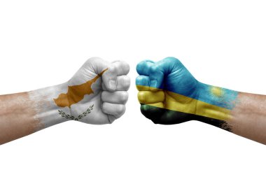 Two hands punch to each others on white background. Country flags painted fists, conflict crisis concept between cyprus and rwanda