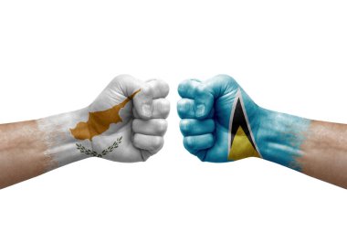 Two hands punch to each others on white background. Country flags painted fists, conflict crisis concept between cyprus and saint lucia