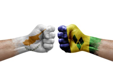 Two hands punch to each others on white background. Country flags painted fists, conflict crisis concept between cyprus and saint vincent and the grenadines