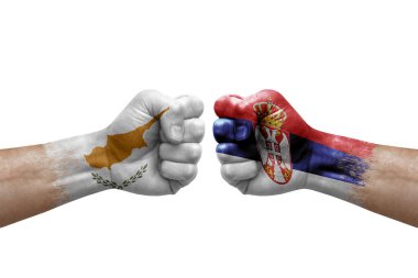 Two hands punch to each others on white background. Country flags painted fists, conflict crisis concept between cyprus and serbia