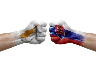 Two hands punch to each others on white background. Country flags painted fists, conflict crisis concept between cyprus and slovakia