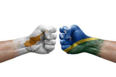 Two hands punch to each others on white background. Country flags painted fists, conflict crisis concept between cyprus and solomon islands