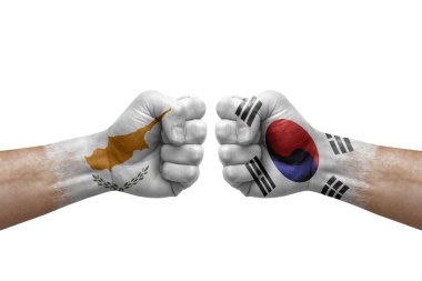Two hands punch to each others on white background. Country flags painted fists, conflict crisis concept between cyprus and south korea